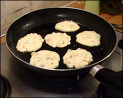 Korean Pancakes Frying in a pan